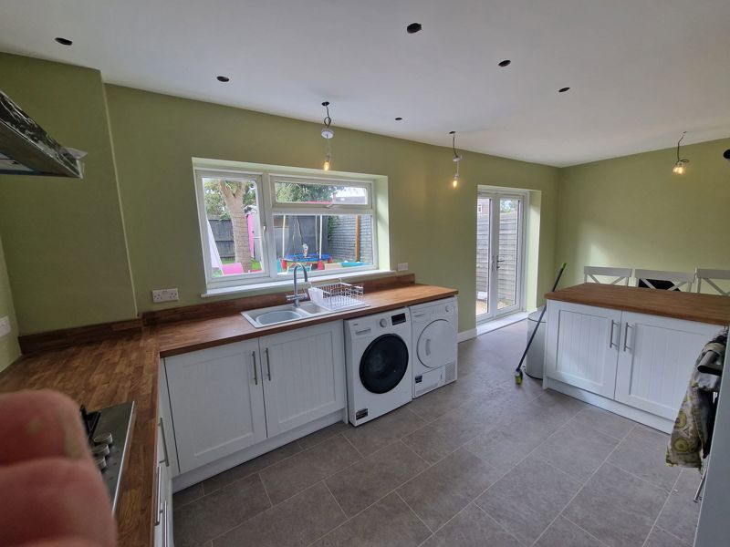 Finished kitchen with green walls